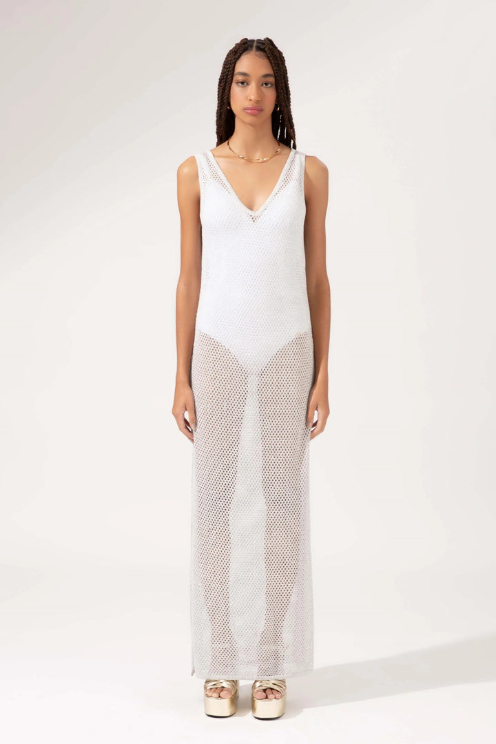 a white sleeveless dress with a sheer overlay