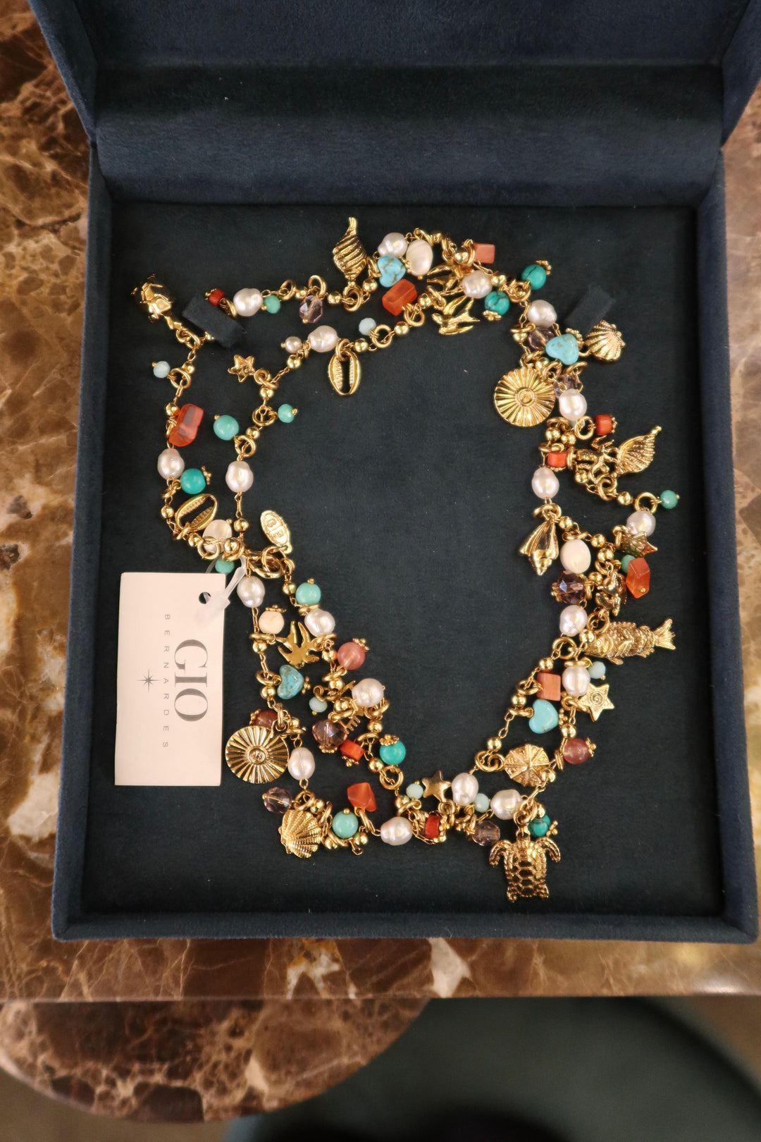 LONG NECKLACE WITH SEA PENDANTS