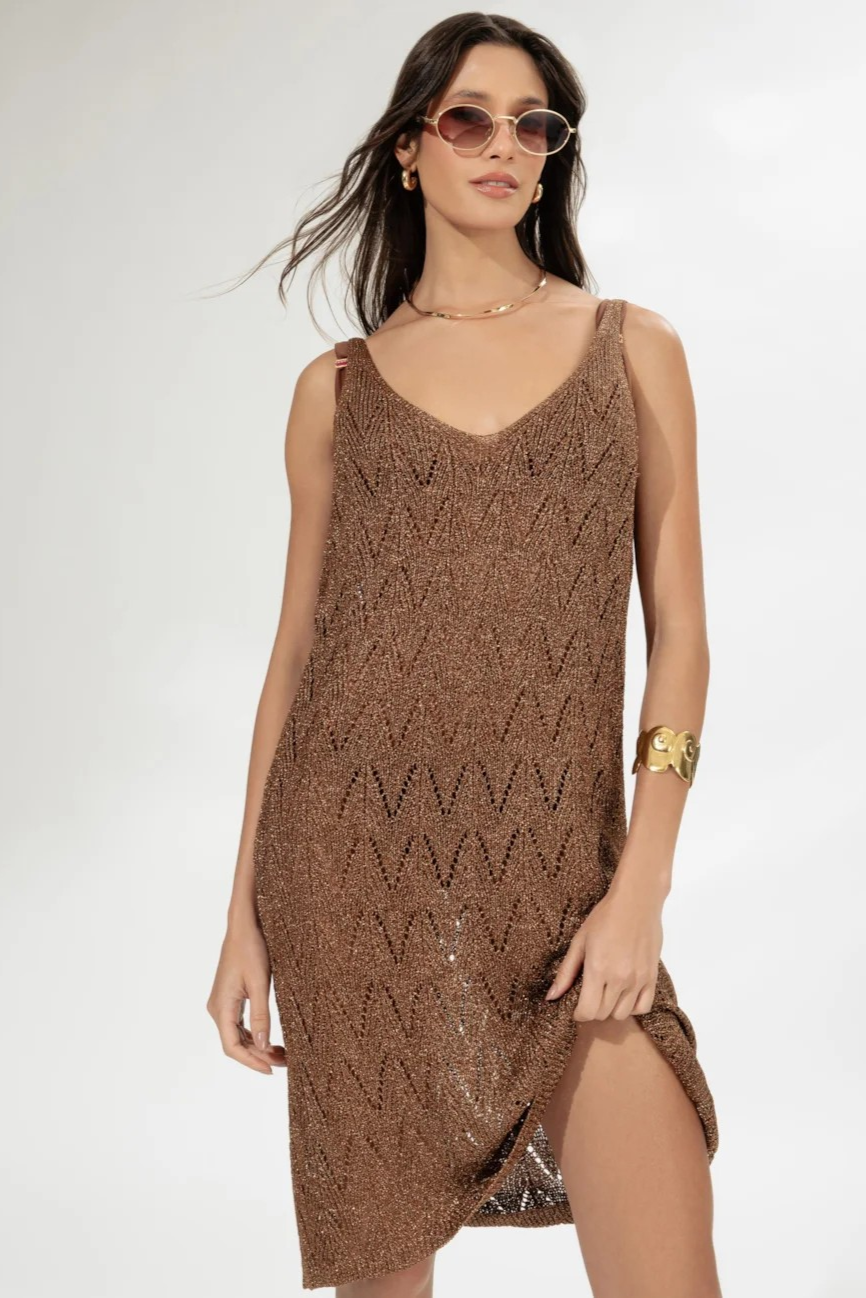 caramel-colored, sleeveless, knee-length knit dress with a v-neckline.