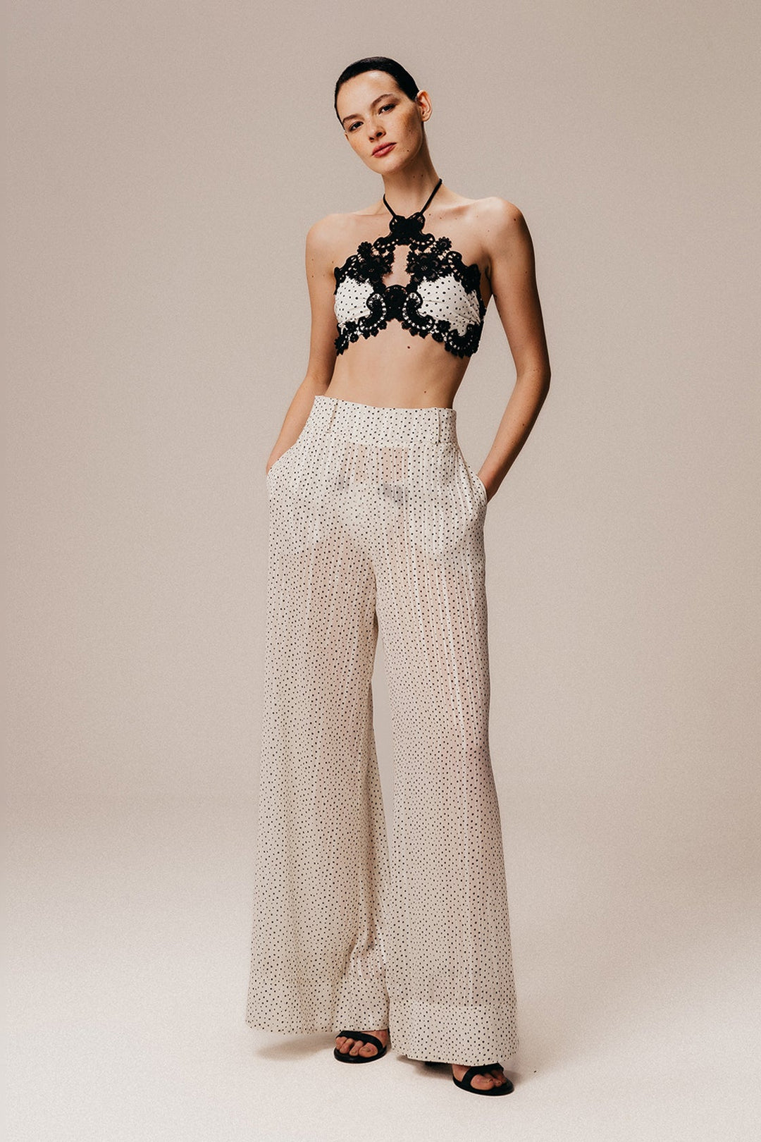 A white georgette palazzo pants with a polka dot print.