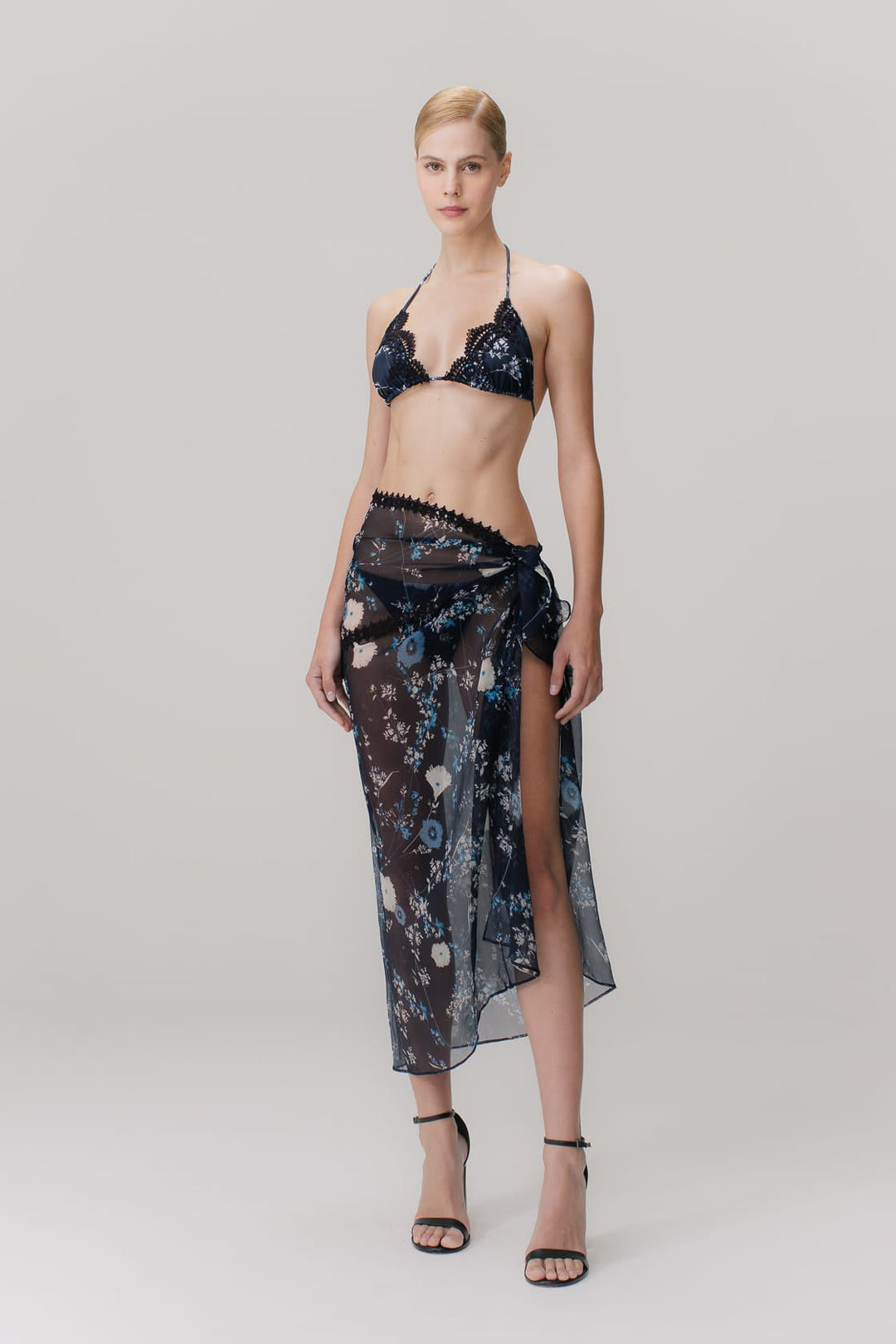 A floral blue printed silk pareo with guipure appliqués