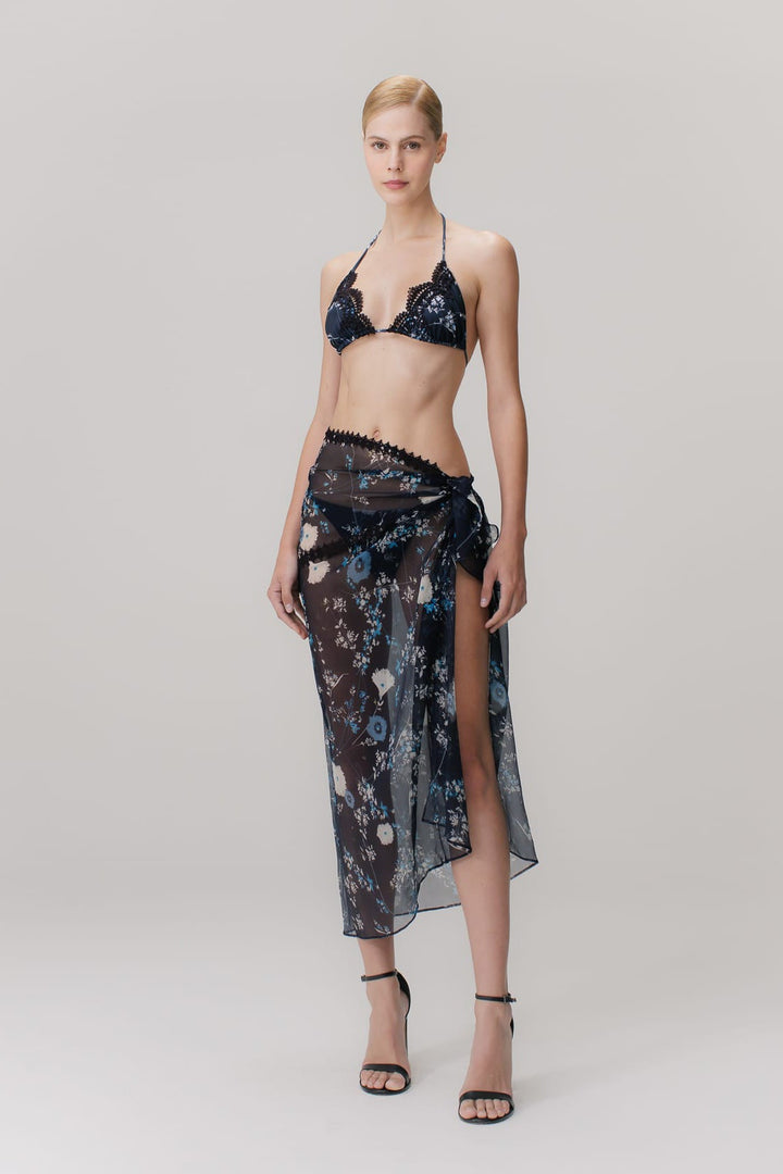 A floral blue printed silk pareo with guipure appliqués