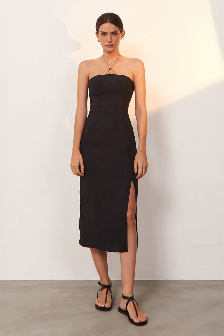 a strapless, black, midi dress with a side slit
